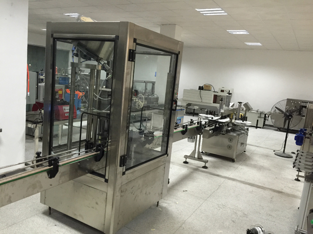 talian capping mesin pelabelan.jpg