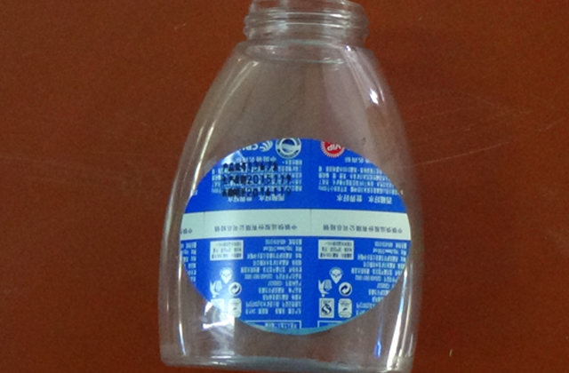 mesin pelabelan bergolek untuk sampel botol rata.jpg